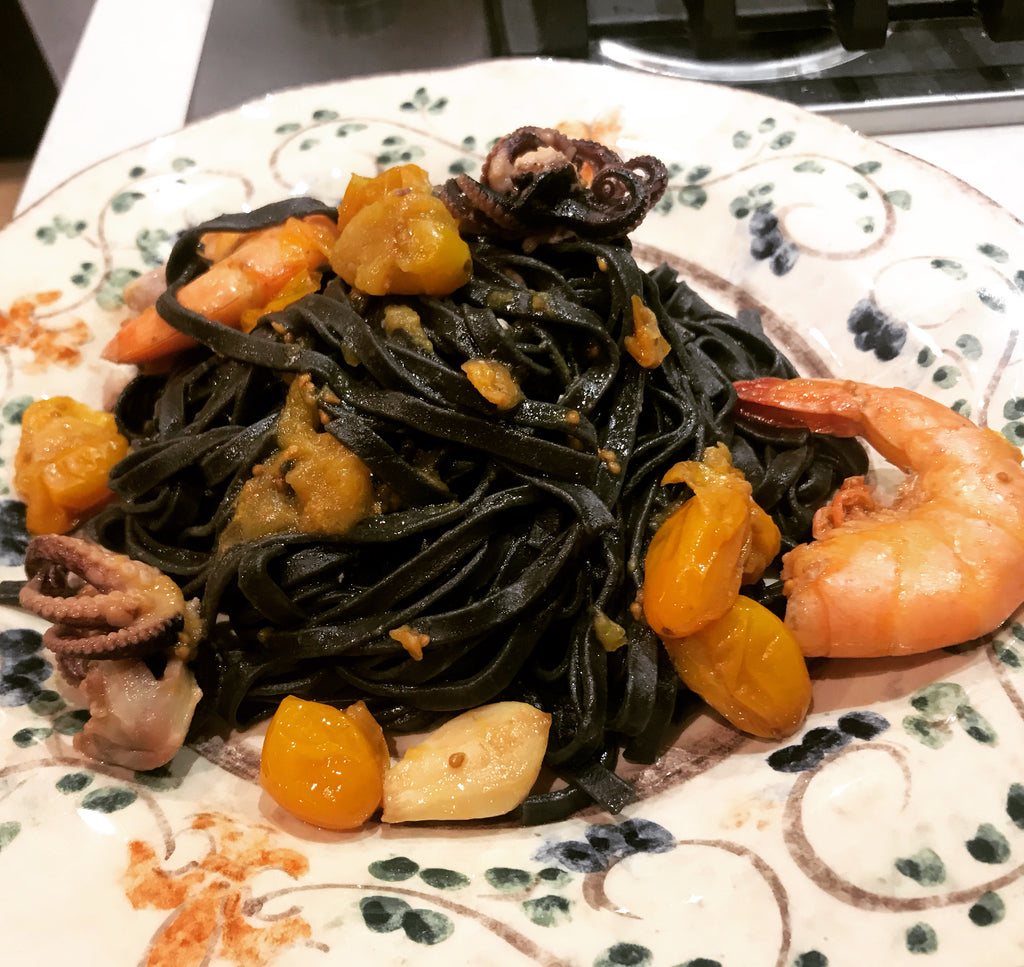 Tagliatelle nere(squid ink) with mixed seafood and yellow datterino tomatoes