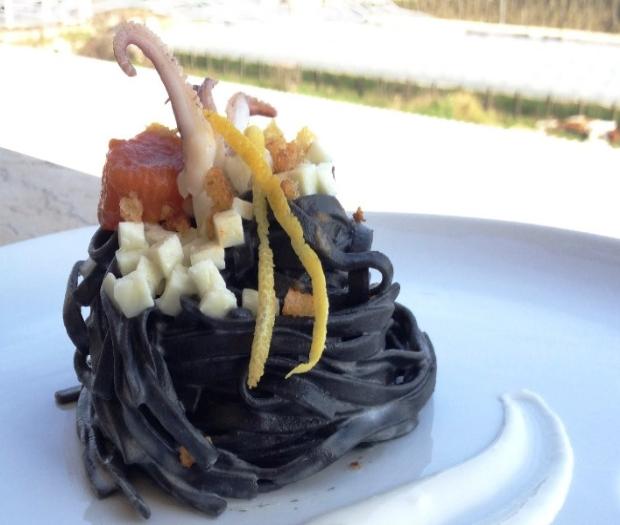 Tagliatelle nere with squid, cubes of mozzarella and crunchy bread, creamed with mozzarella sauce